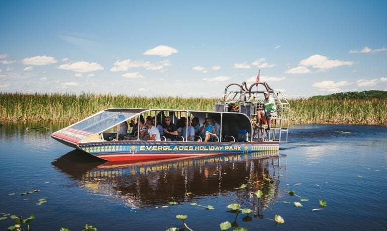 Passengers enjoy a Calm Moment During Miami Airboat Tour at Everglades Holiday Park